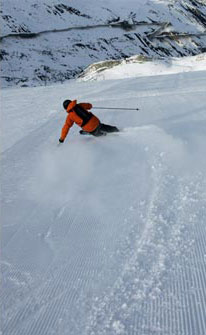 Skier carving turns in Austria