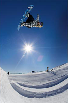 Snowboarder in the half-pipe